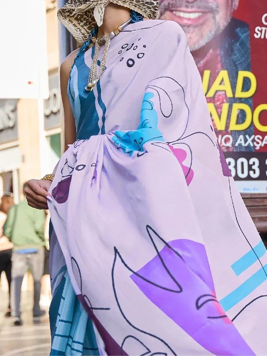 Woman in stylish printed ethnic gown with blue and purple abstract design, perfect for modern Indian fashion.