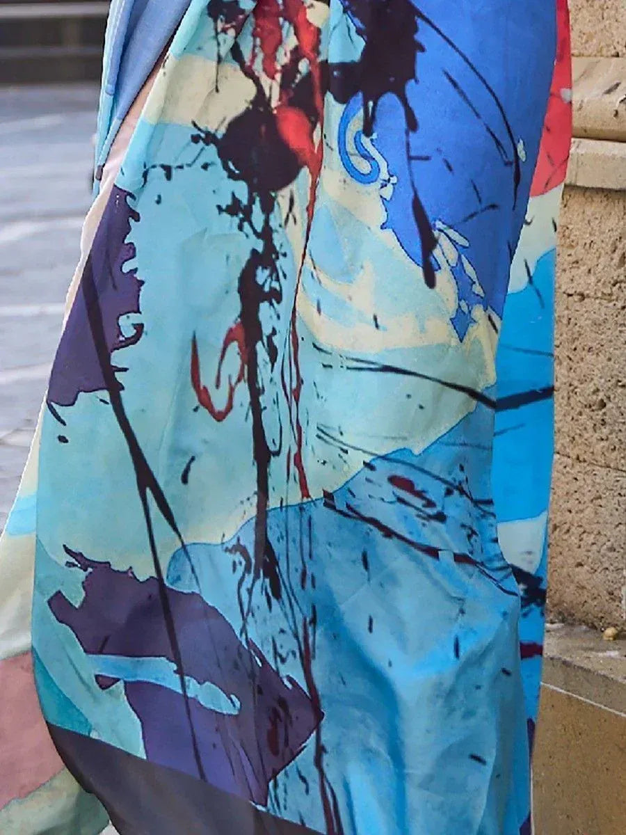 Blue abstract print ethnic gown with artistic splatter design, perfect for festive occasions