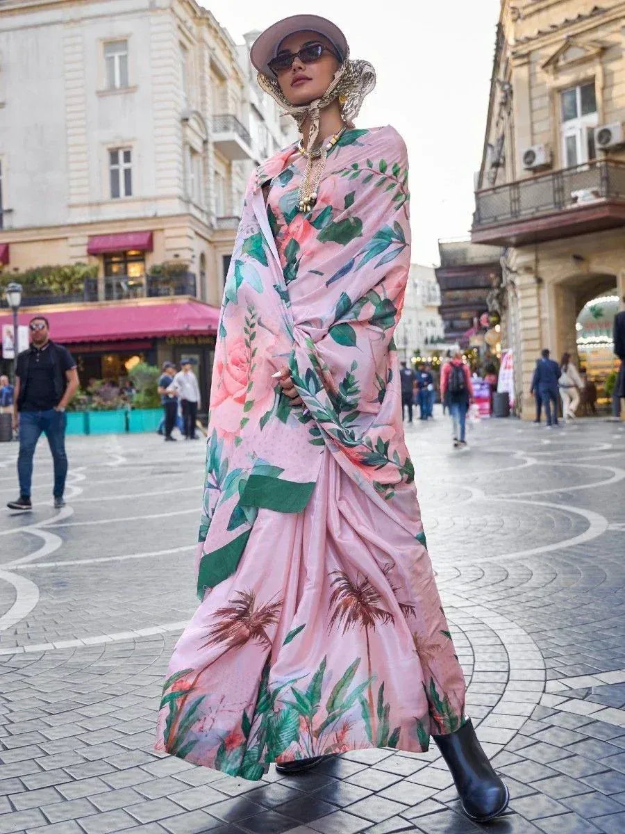 Pink floral printed saree with green leaves, styled with hat and boots for street fashion