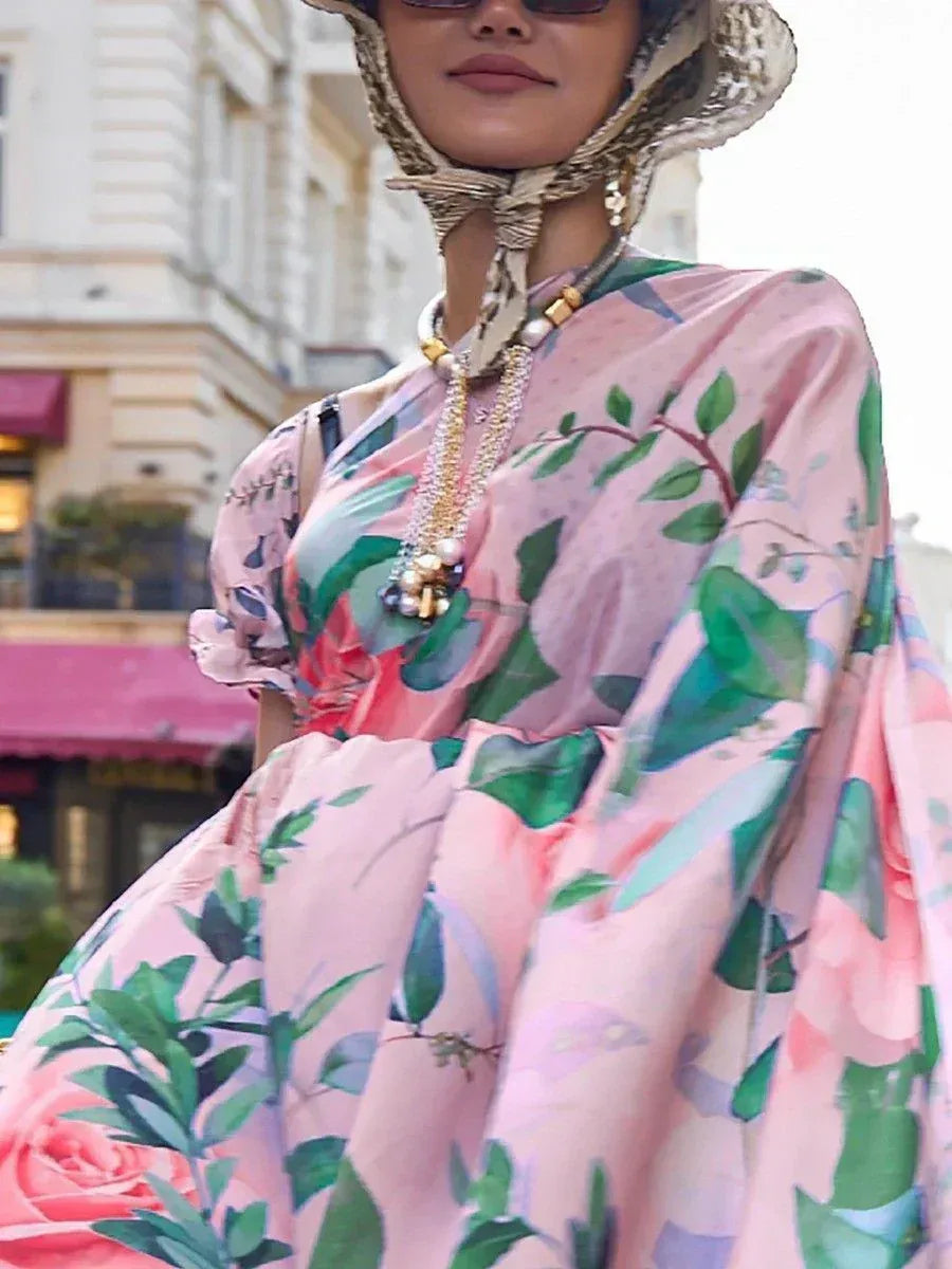Pink floral ethnic gown with green leaf print, styled with pearl necklace and woven hat for women