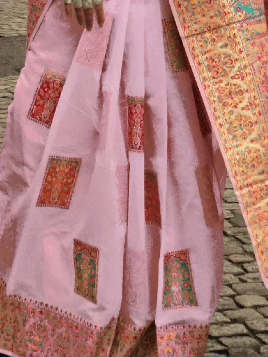 Pink embroidered saree with floral motifs and colorful border, ideal for Indian ethnic wear