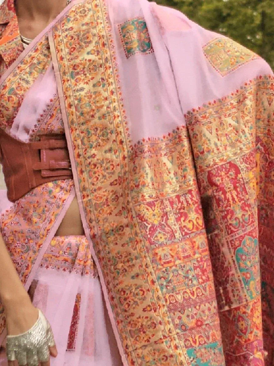 Pink ethnic lehenga choli with intricate floral and paisley print, perfect for Indian weddings and festive occasions.