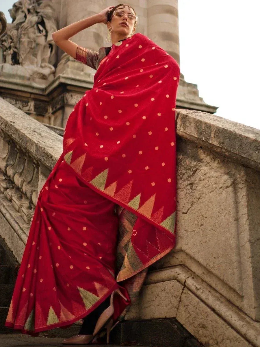 Red ethnic saree with gold polka dots and geometric border, styled for Indian occasions