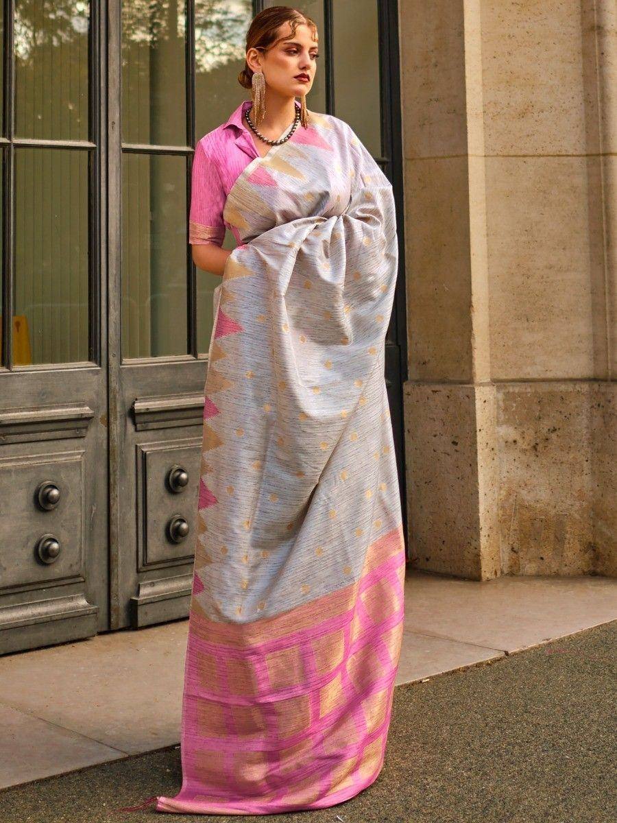Woman in elegant pink and silver saree with geometric print, styled with blouse for Indian ethnic wear
