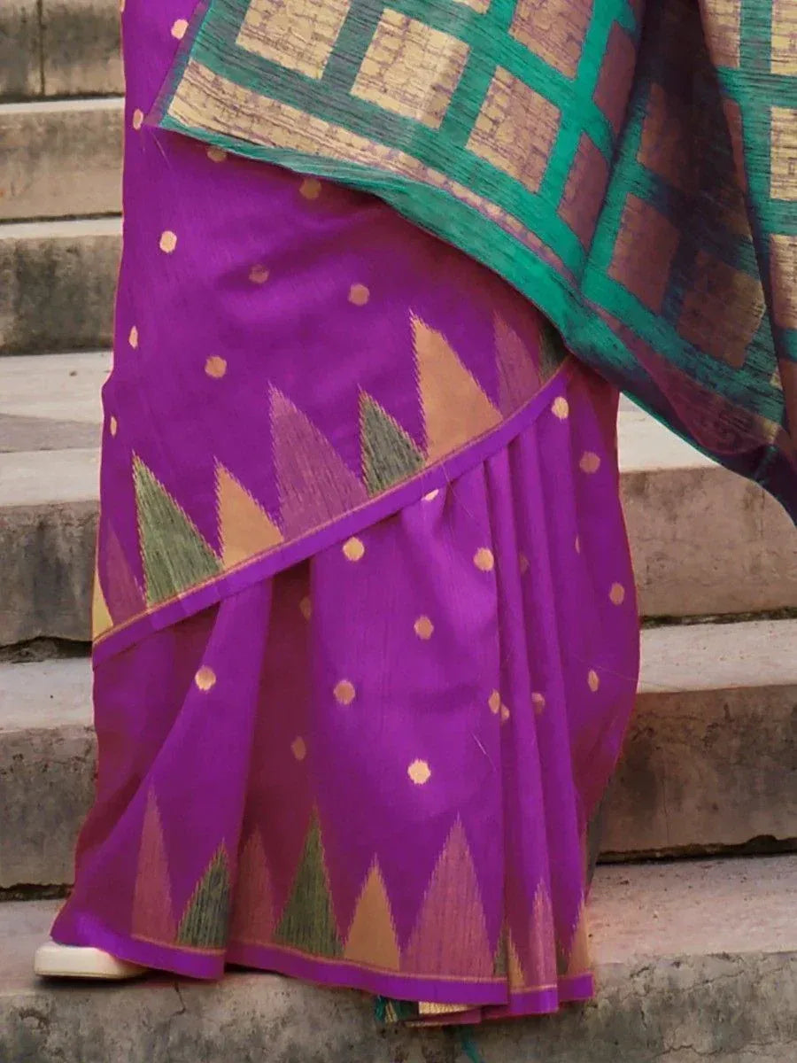 Purple ethnic saree with gold dots and geometric border, styled with green and gold pallu