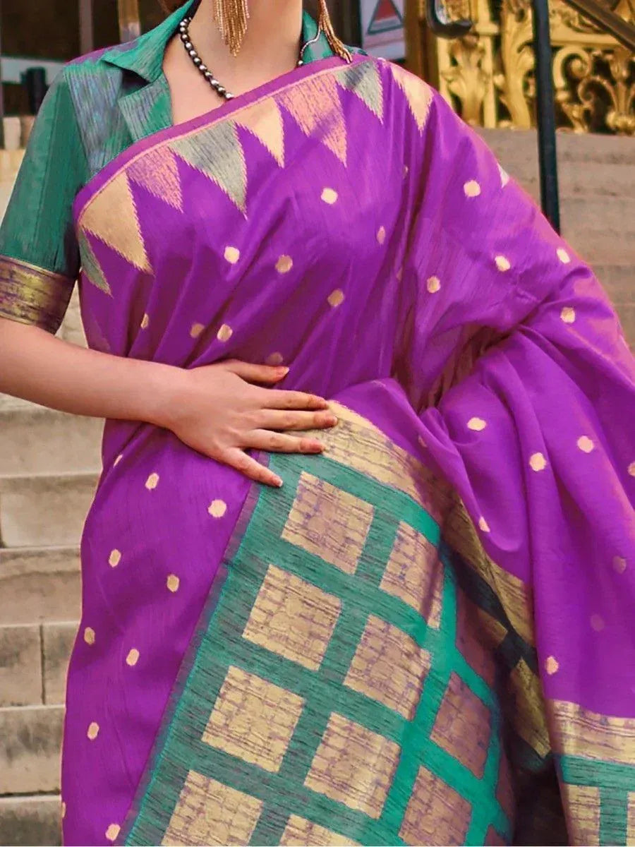 Purple and green ethnic saree with geometric patterns and gold accents, styled with matching blouse