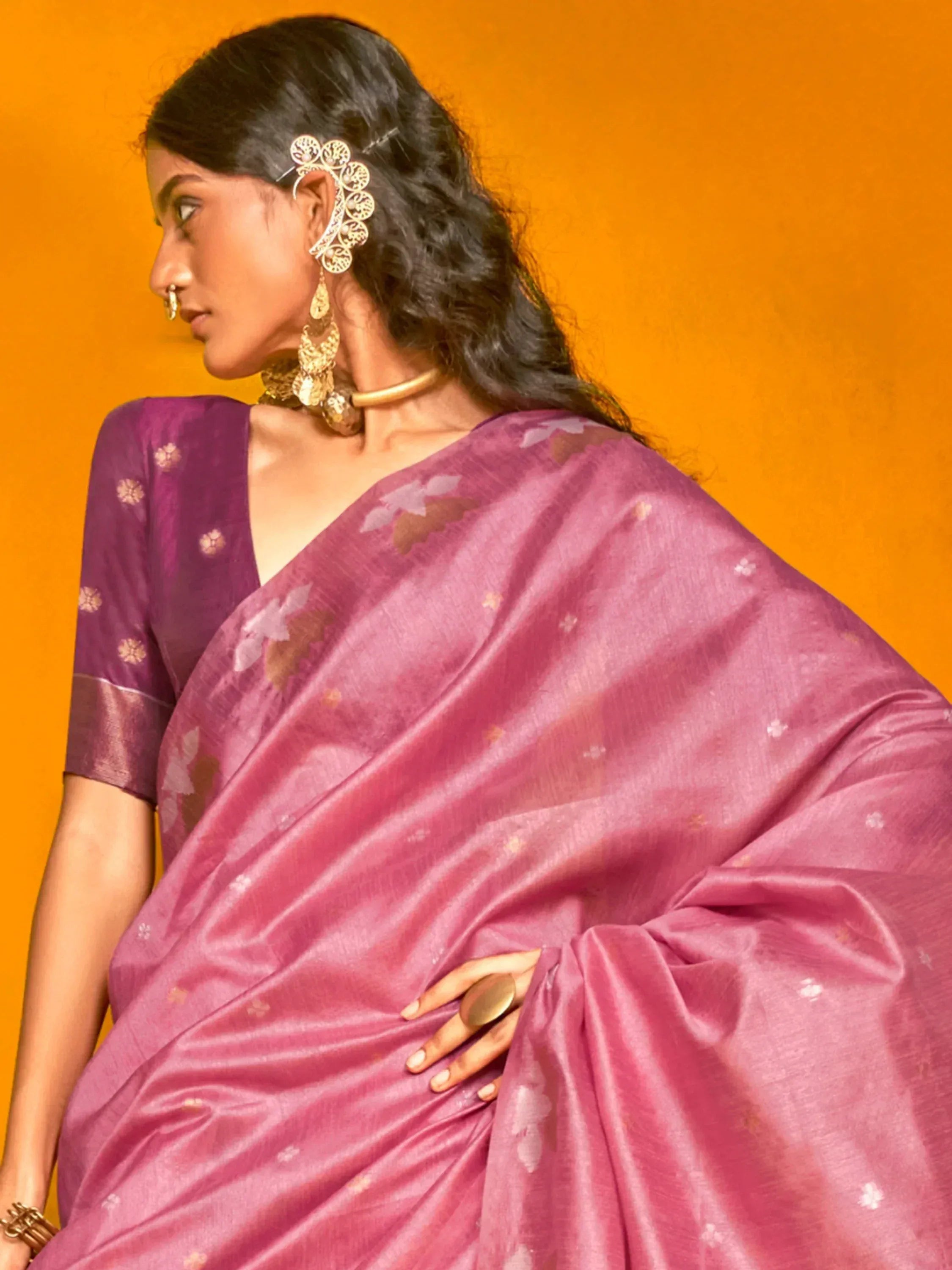 Woman in purple floral saree with gold jewelry, Indian ethnic wear