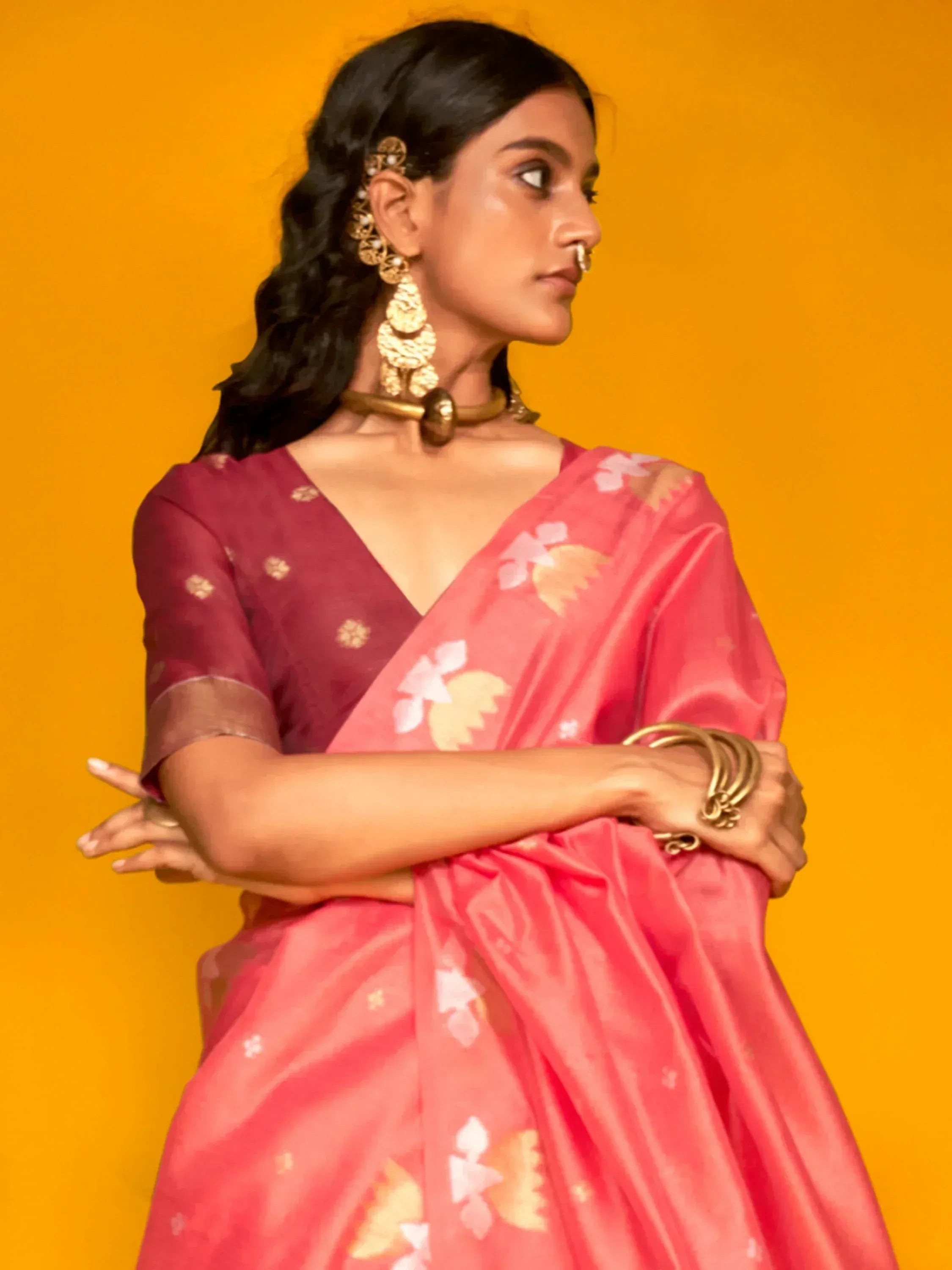 Woman in pink floral saree with gold jewelry, Indian ethnic wear