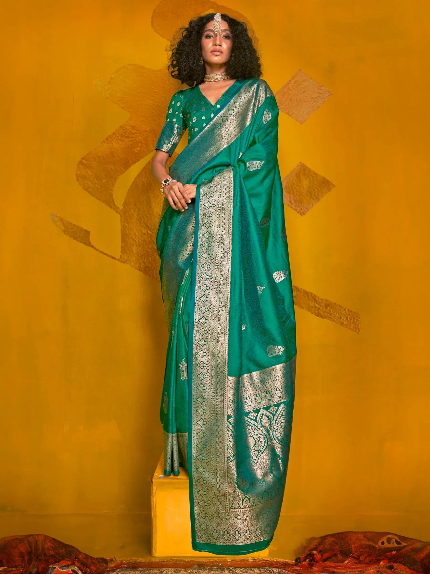 Emerald green designer saree with silver zari border, perfect for Indian ethnic wear occasions