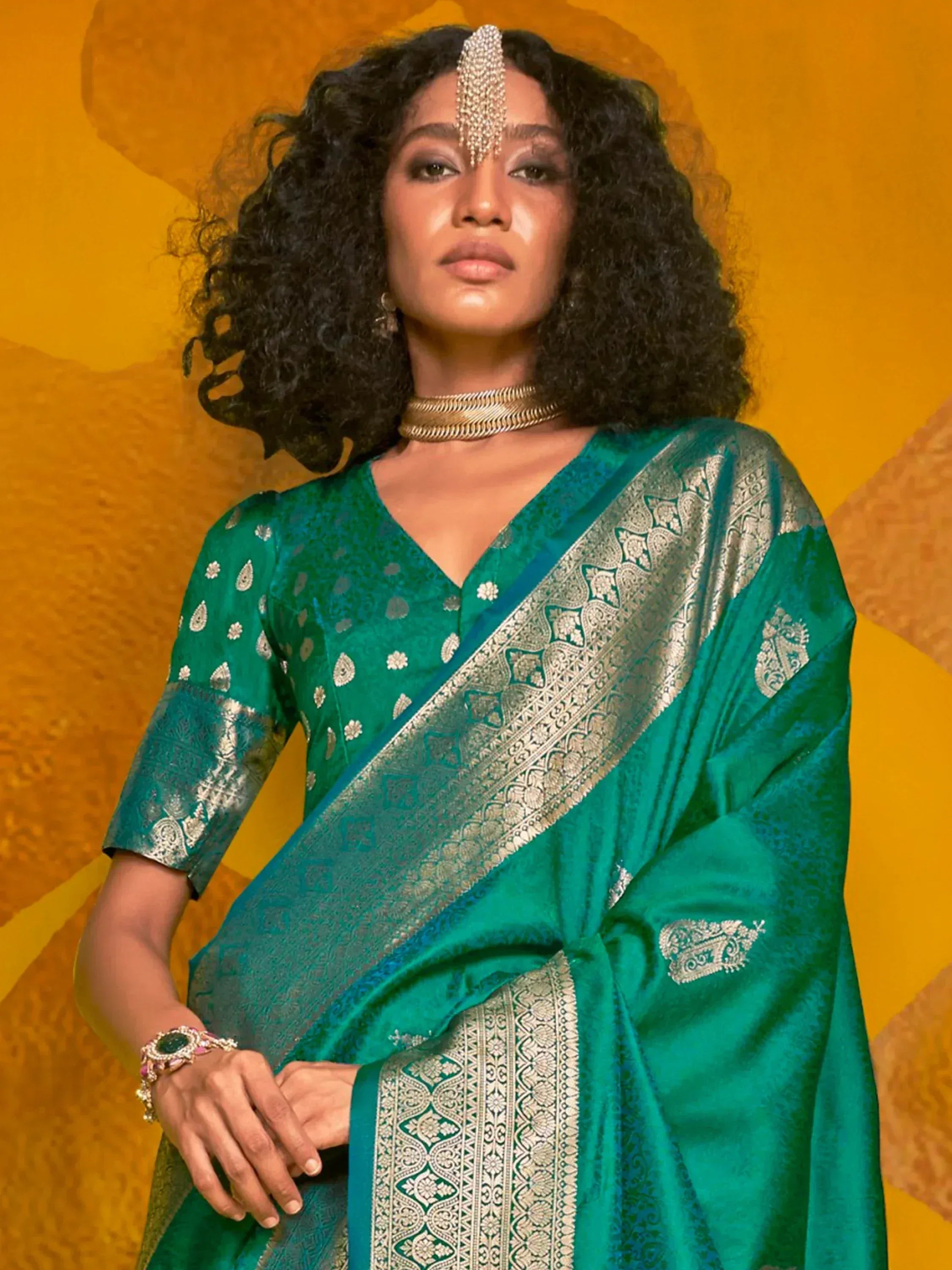 Emerald green designer saree with silver zari work, perfect for Indian ethnic wear and festive occasions