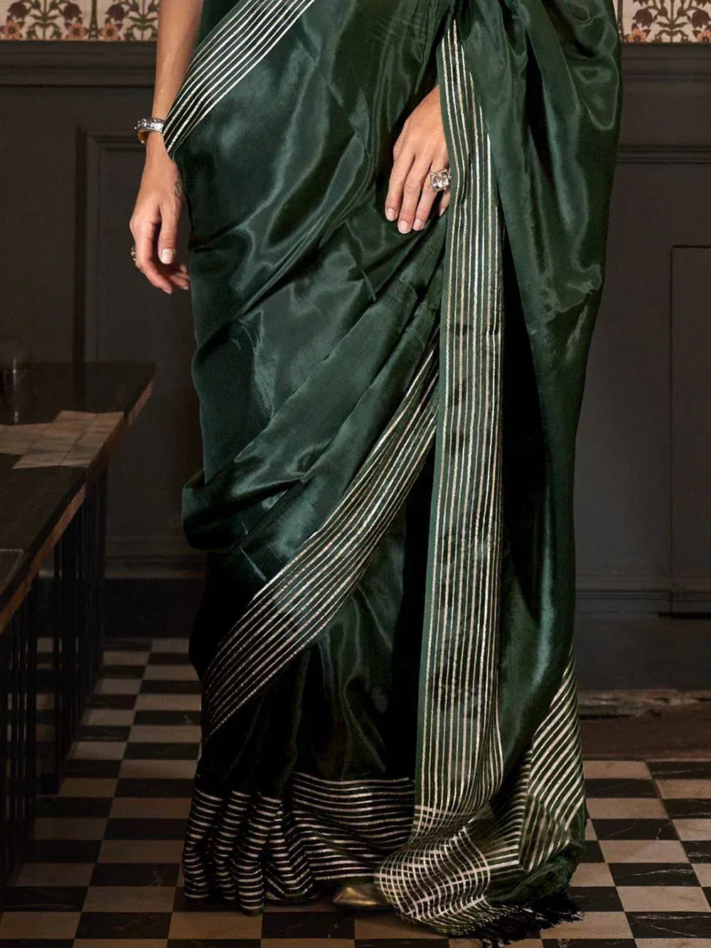 Emerald green silk saree with gold stripes, elegant ethnic wear for women