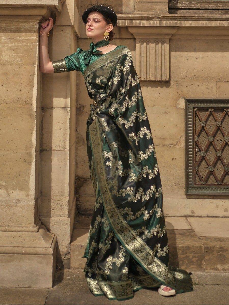 Elegant green silk saree with gold floral embroidery, paired with matching blouse and statement earrings.
