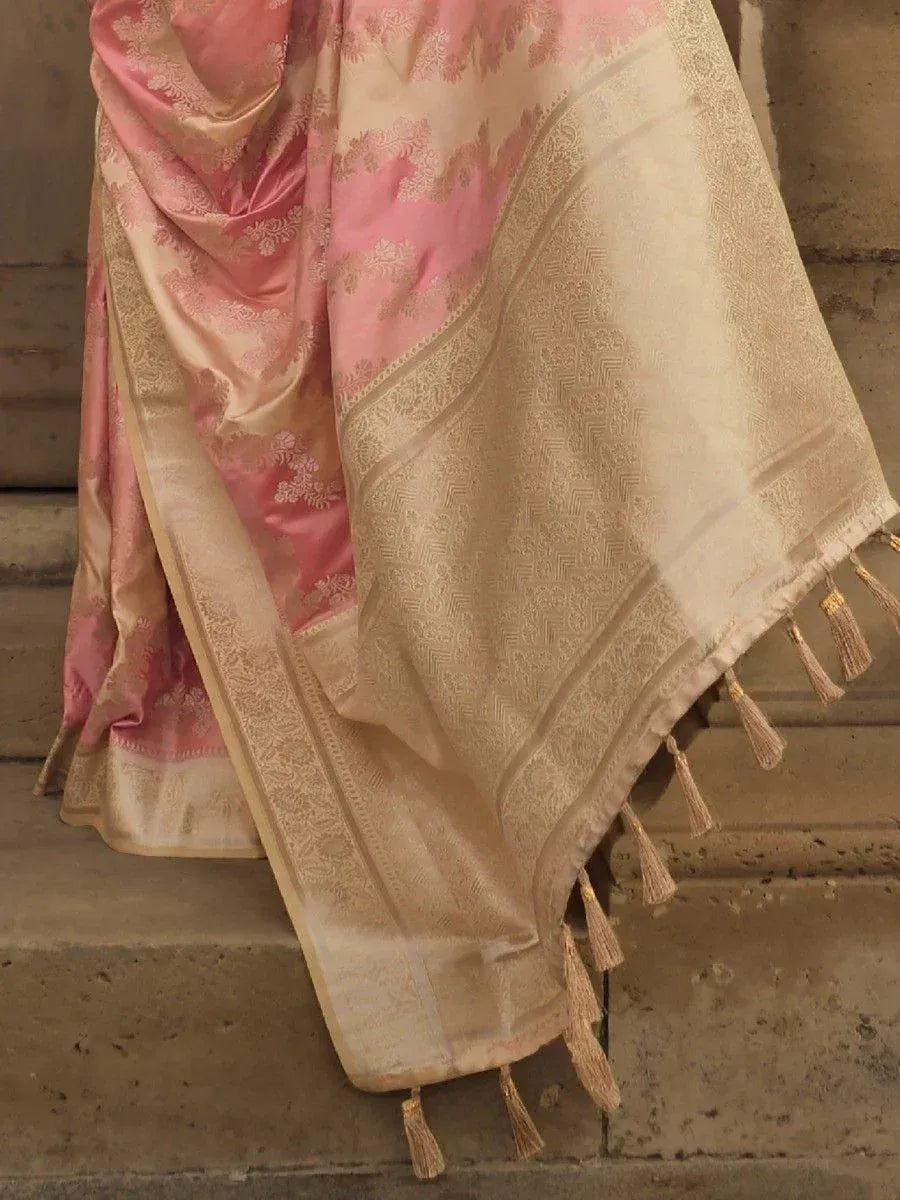 Pink and beige designer saree with gold floral embroidery and tassels, perfect for ethnic occasions