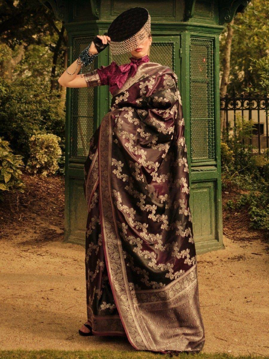 Elegant maroon saree with gold floral embroidery, paired with a matching blouse and black hat, perfect for Indian ethnic wear.