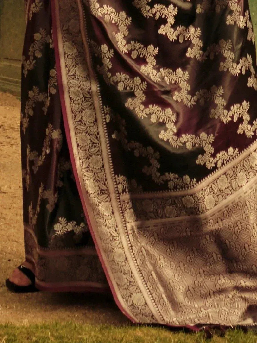 Elegant dark purple saree with gold floral embroidery and intricate border, perfect for ethnic occasions.