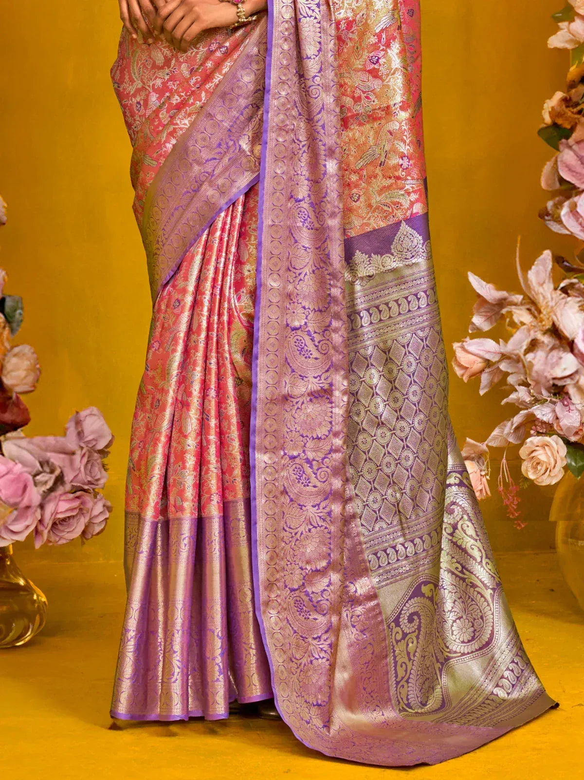 Elegant pink and purple designer saree with intricate paisley and floral patterns, perfect for ethnic occasions.
