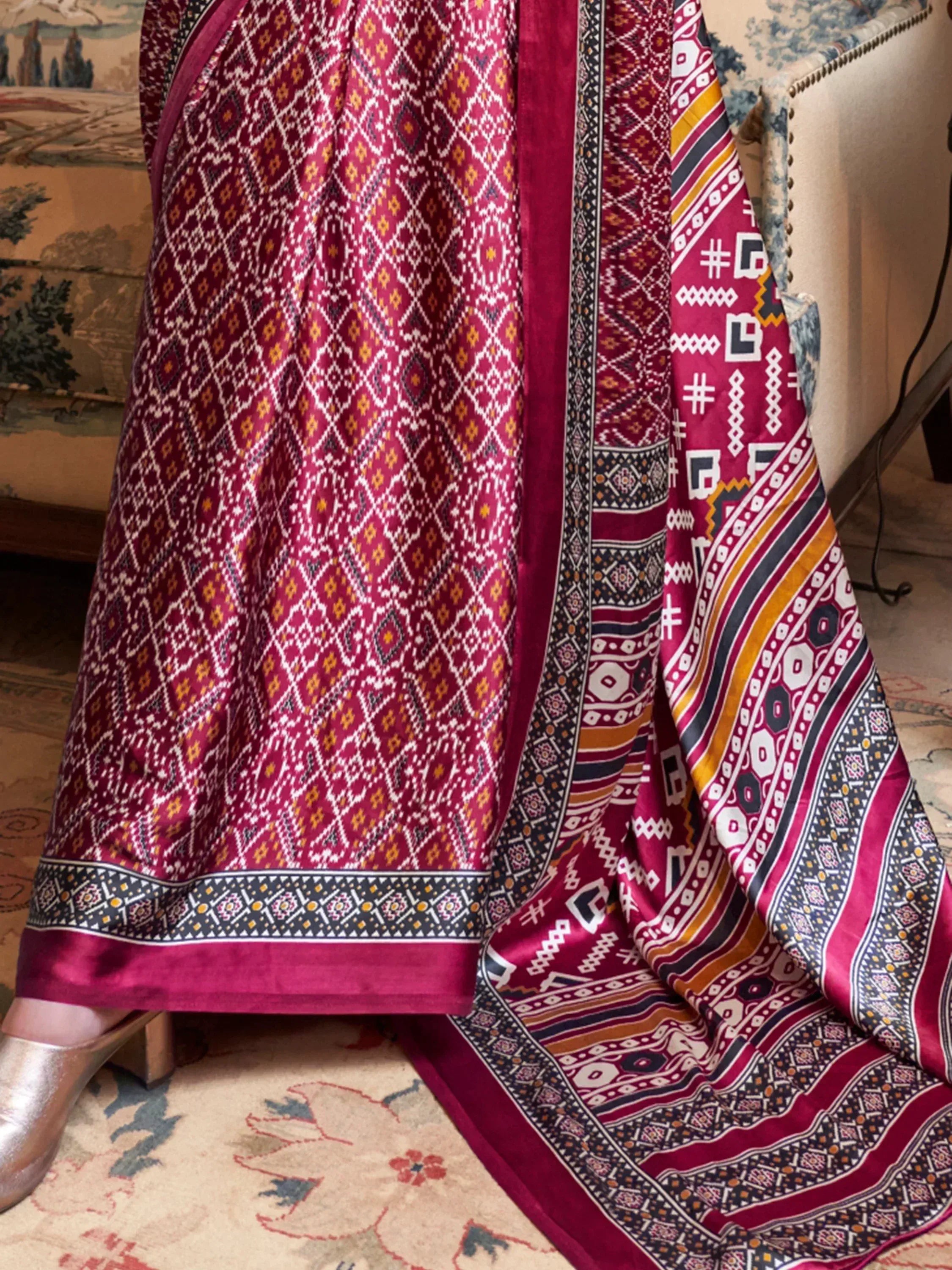 Maroon ethnic gown with geometric print and velvet border, paired with matching dupatta for Indian wear