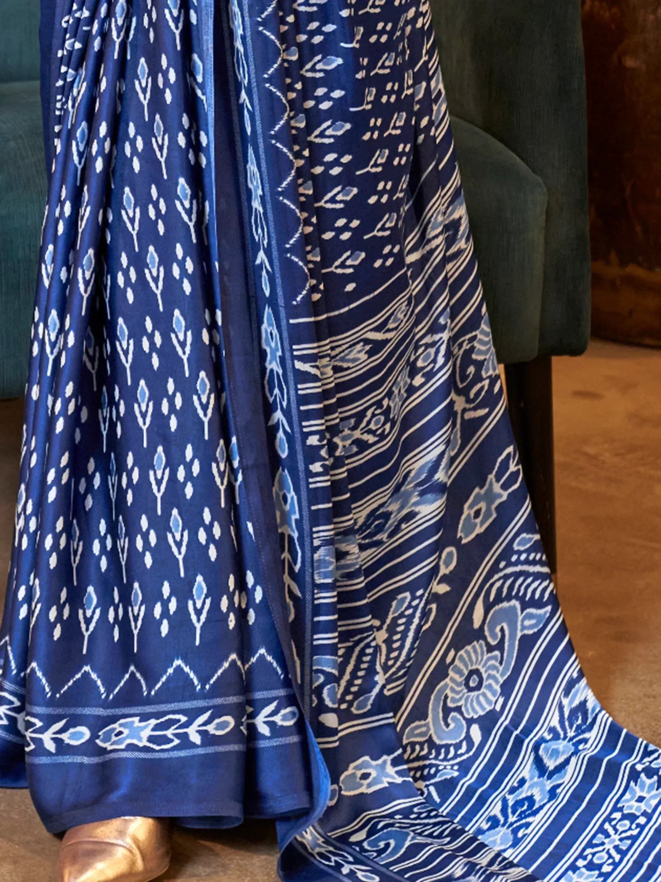 Blue ikat print ethnic gown with floral motifs and border detailing, perfect for Indian occasions