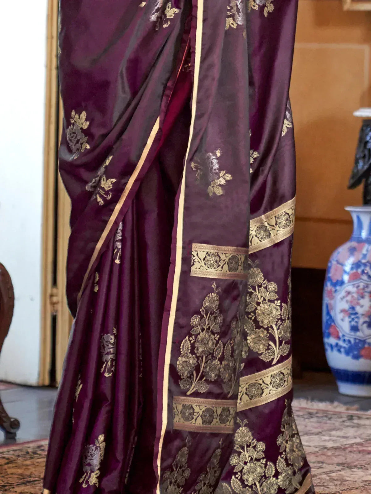 Elegant purple saree with gold floral embroidery and border, ideal for Indian ethnic occasions.