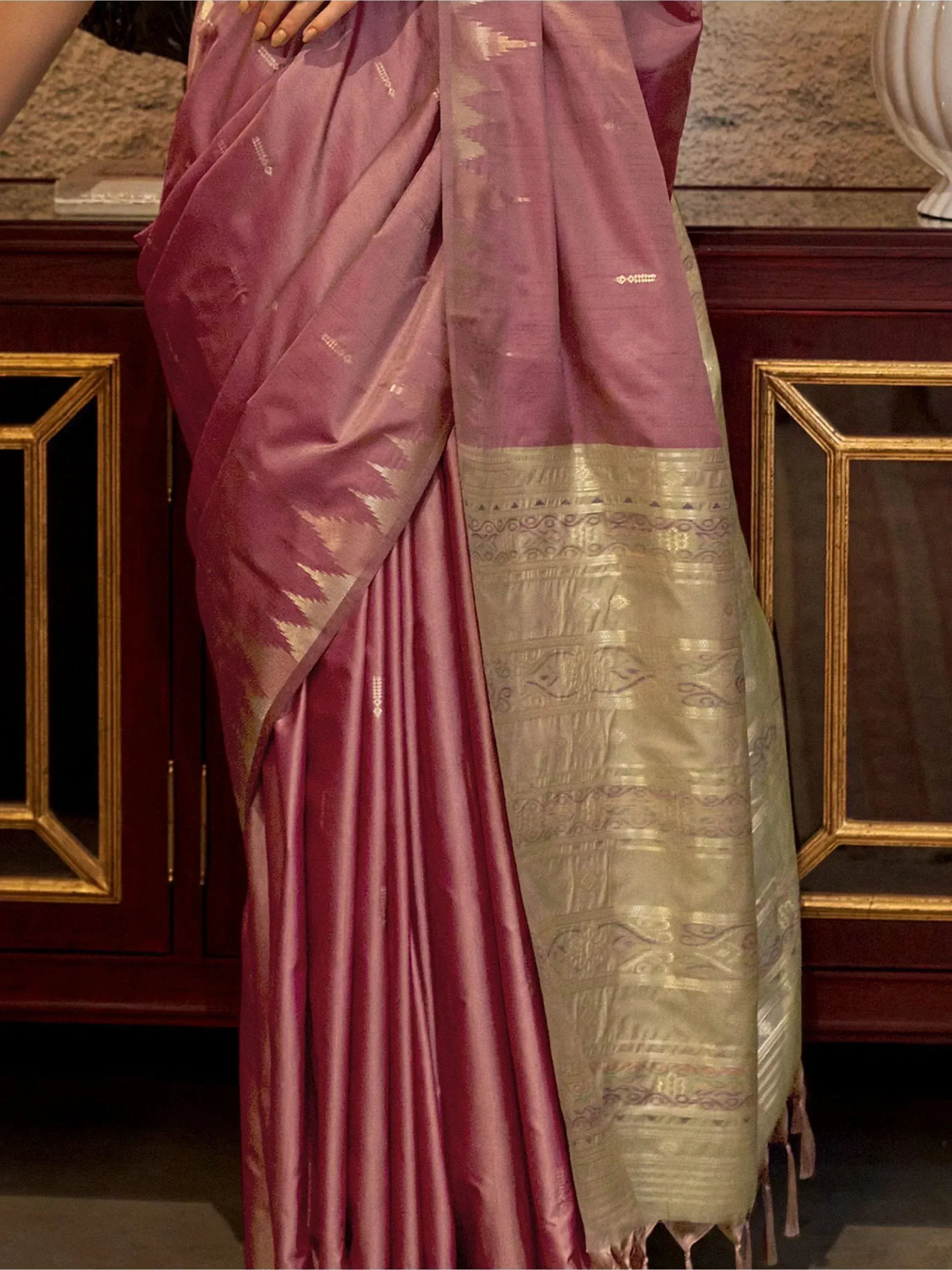 Elegant mauve silk saree with gold zari border and intricate woven patterns, perfect for Indian ethnic occasions.