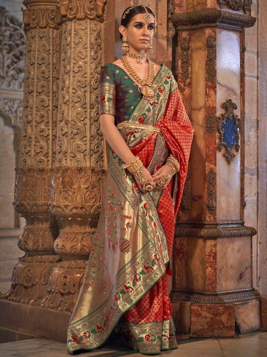 Elegant Indian saree with gold embroidery, red and green border, paired with traditional jewelry for festive occasions