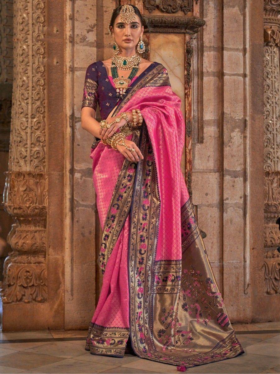 Pink and purple designer saree with gold embroidery, worn with traditional Indian jewelry and blouse