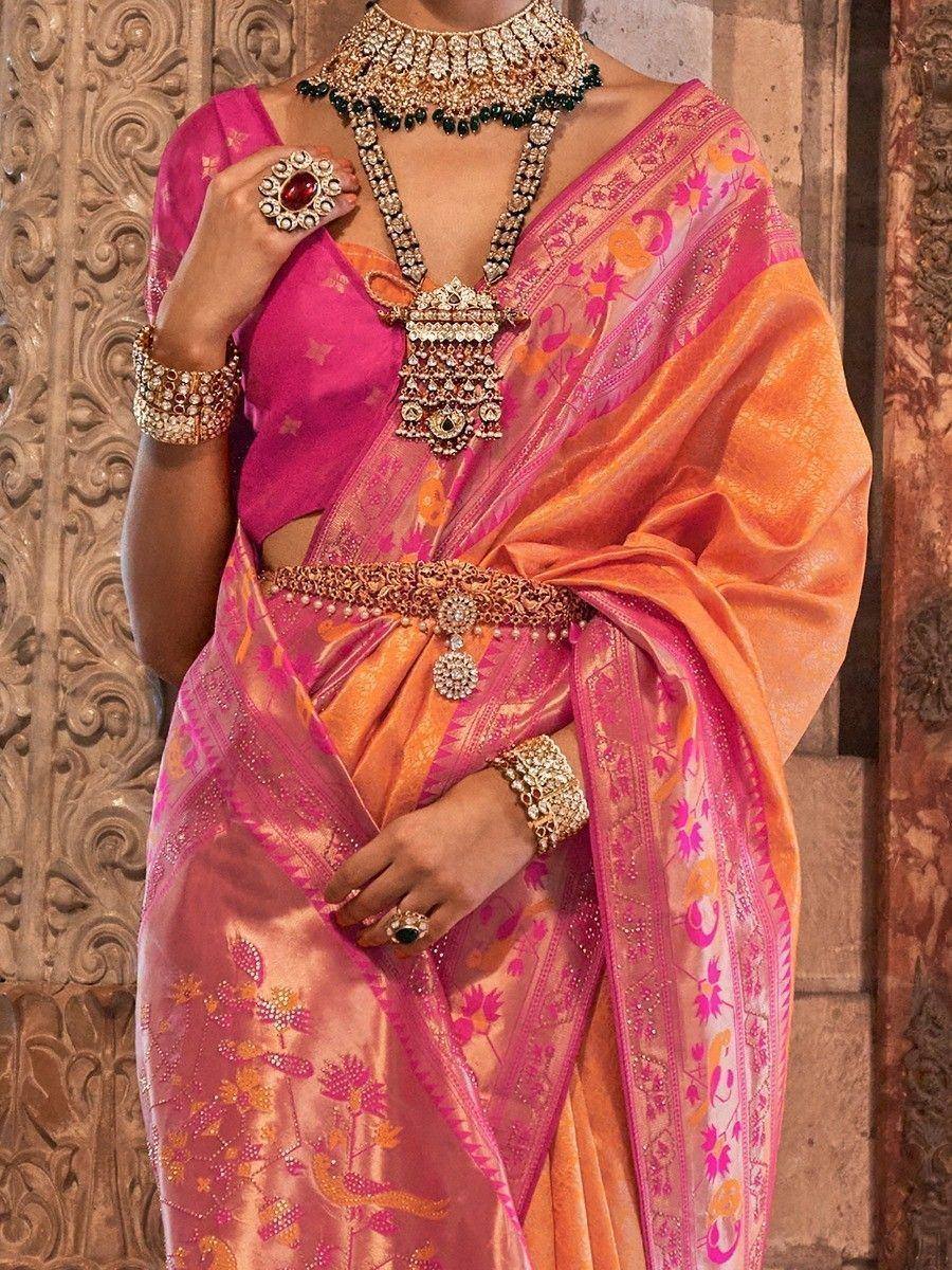 Pink and orange designer saree with floral embroidery and heavy jewelry for Indian ethnic wear