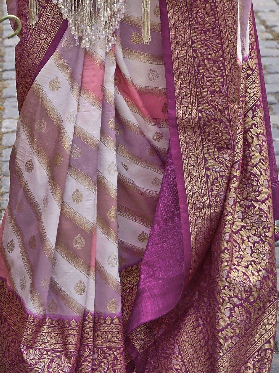 Purple and gold embroidered saree with intricate zari work and striped pallu, perfect for ethnic occasions.