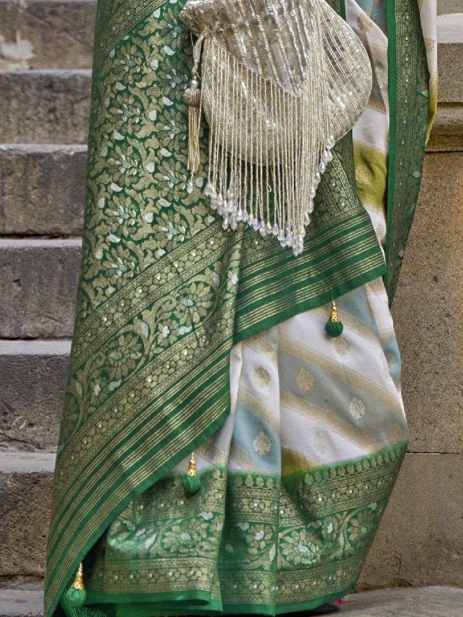 Green and gold embroidered saree with tassels, ideal for Indian ethnic wear and festive occasions.