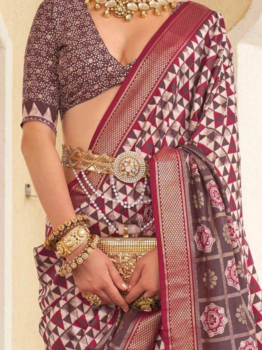 Elegant maroon and brown geometric print saree with designer blouse and gold jewelry