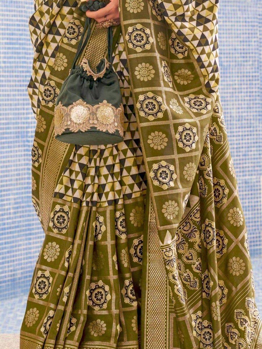 Olive green ethnic saree with geometric floral print, paired with embroidered potli bag for Indian occasions