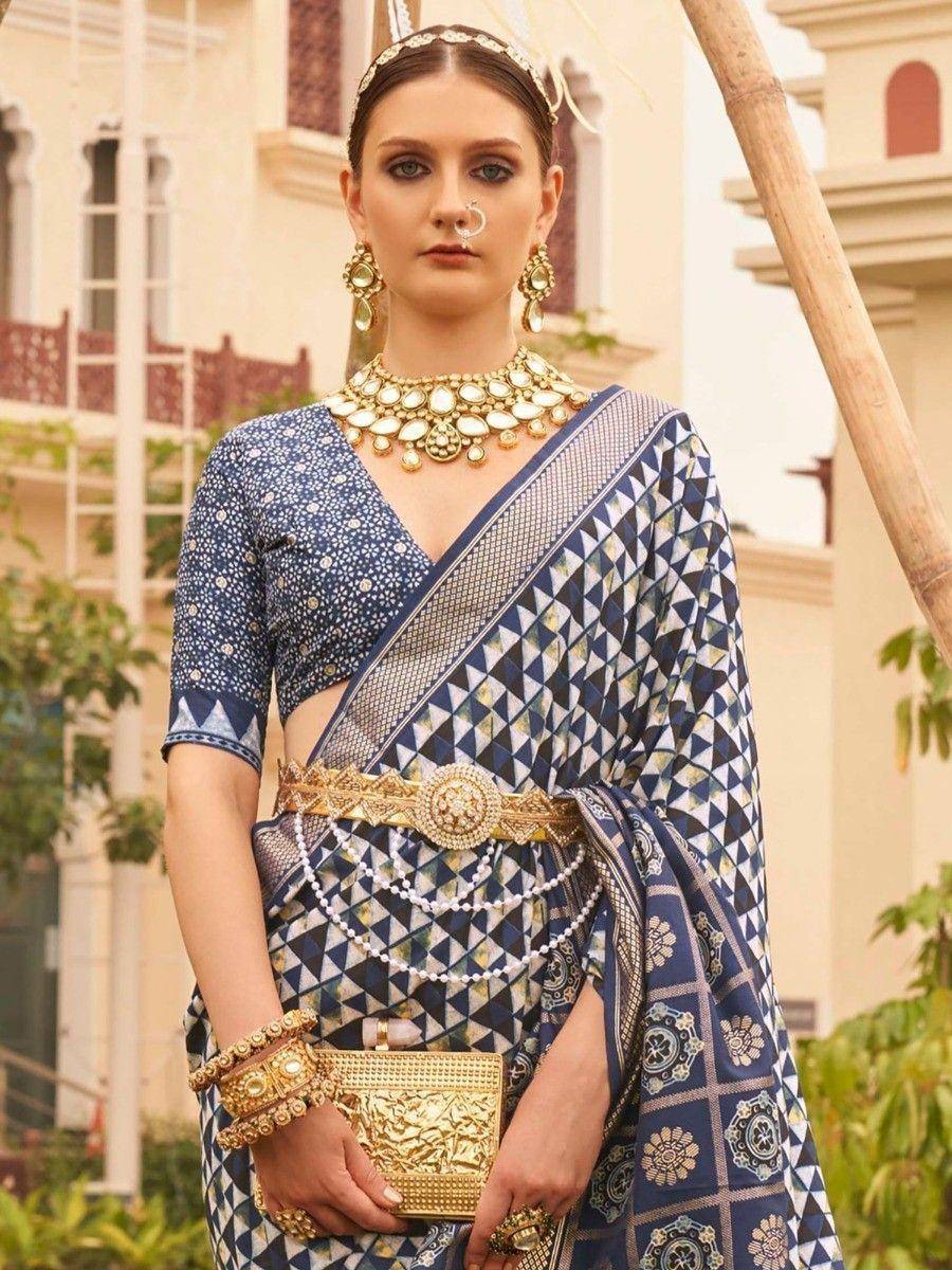 Blue geometric print saree with gold jewelry, perfect for Indian ethnic occasions