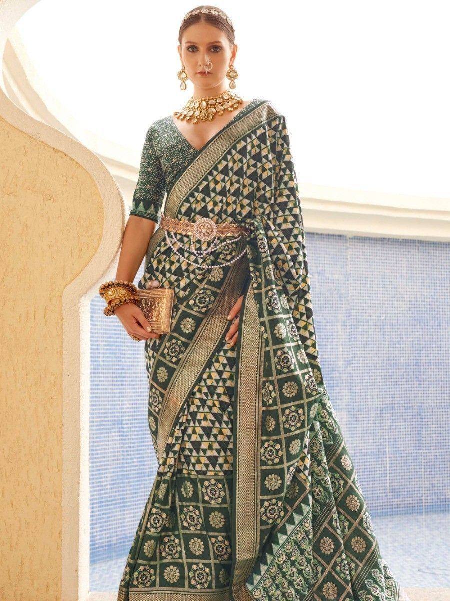 Elegant green printed saree with gold jewelry, perfect for Indian ethnic wear occasions