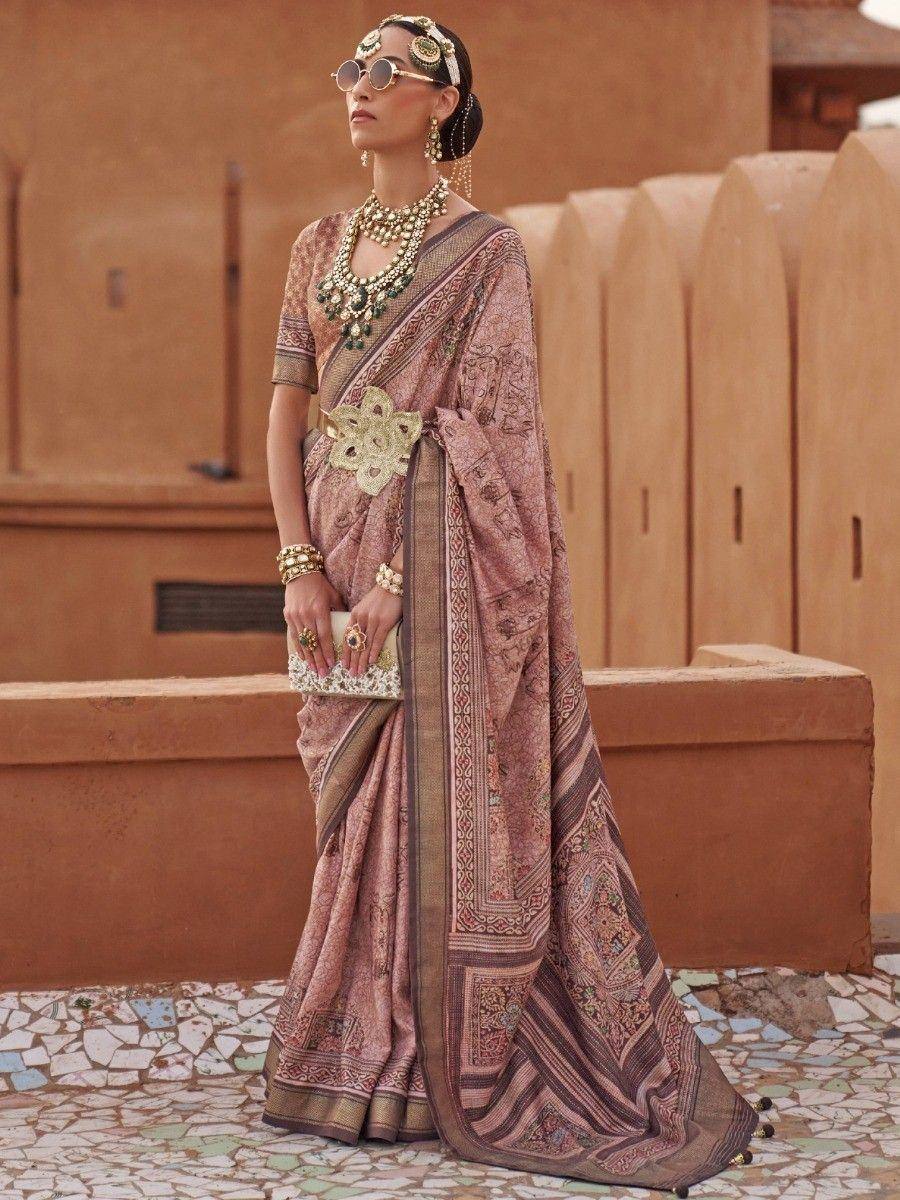 Elegant Indian saree with intricate embroidery, traditional jewelry, and vintage sunglasses for festive occasions.