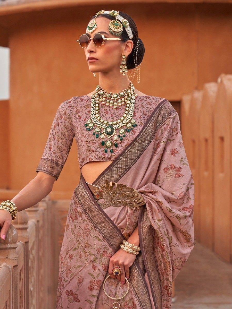 Elegant mauve floral saree with gold border, paired with designer jewelry and sunglasses for a modern ethnic look