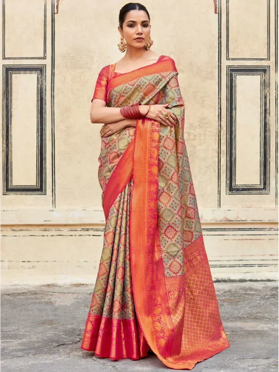 Woman in traditional Indian saree with intricate gold and red patterns, perfect for ethnic occasions