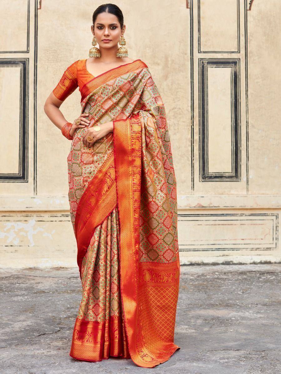 Orange and gold designer saree with intricate patterns, perfect for Indian ethnic wear occasions