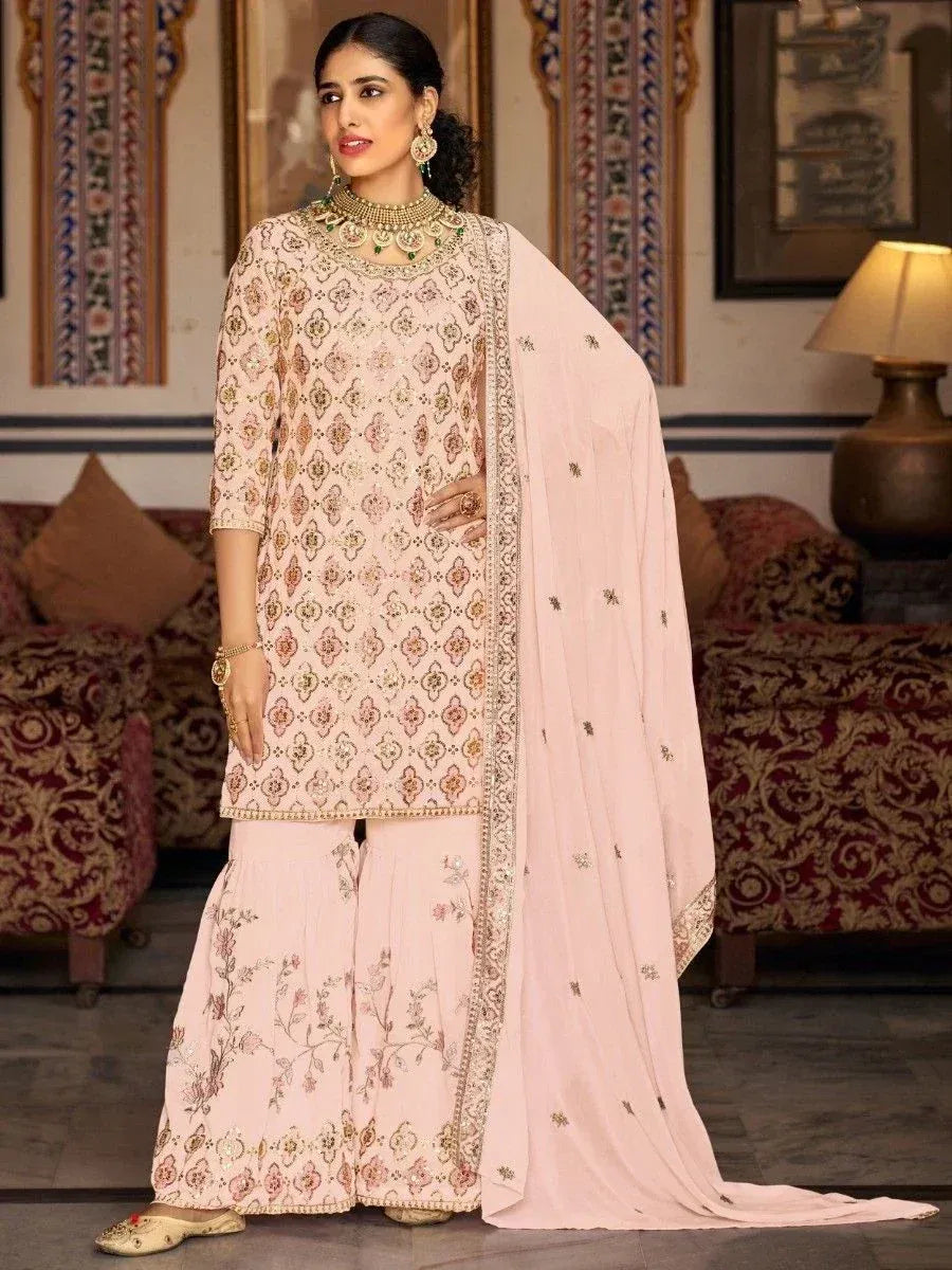 Elegant pink embroidered salwar kameez with floral motifs and matching dupatta, perfect for Indian ethnic occasions