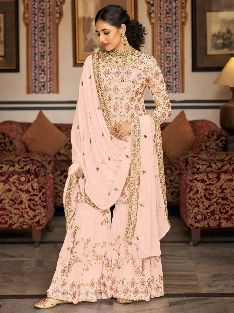 Pink embroidered salwar kameez with gold detailing, perfect for Indian ethnic wear occasions