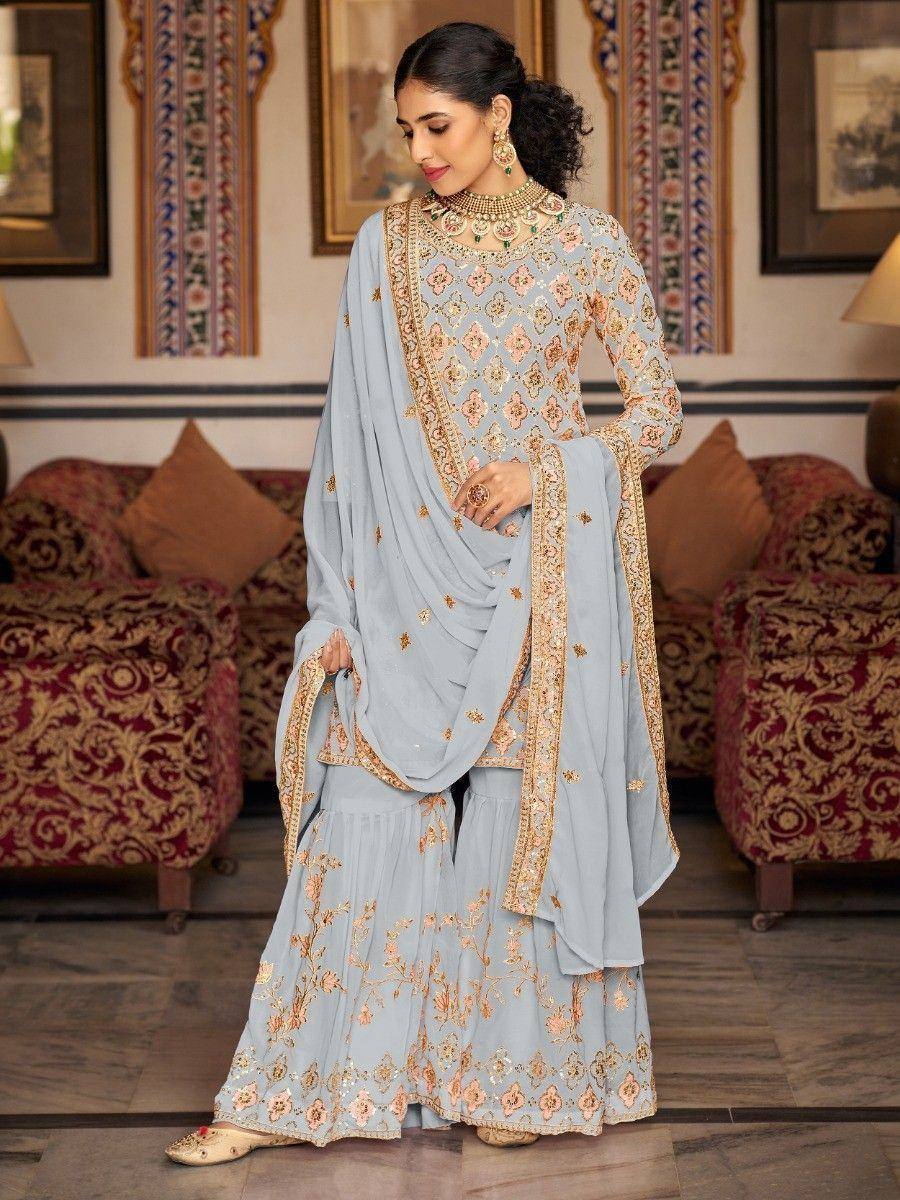 Light blue embroidered salwar kameez with gold detailing, perfect for Indian ethnic occasions