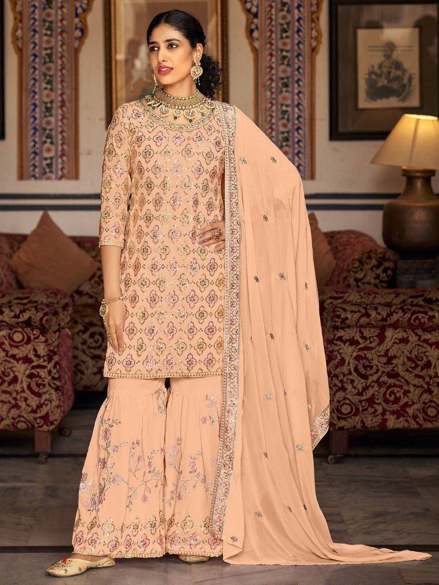 Elegant peach designer salwar kameez with intricate embroidery and matching dupatta for Indian ethnic wear