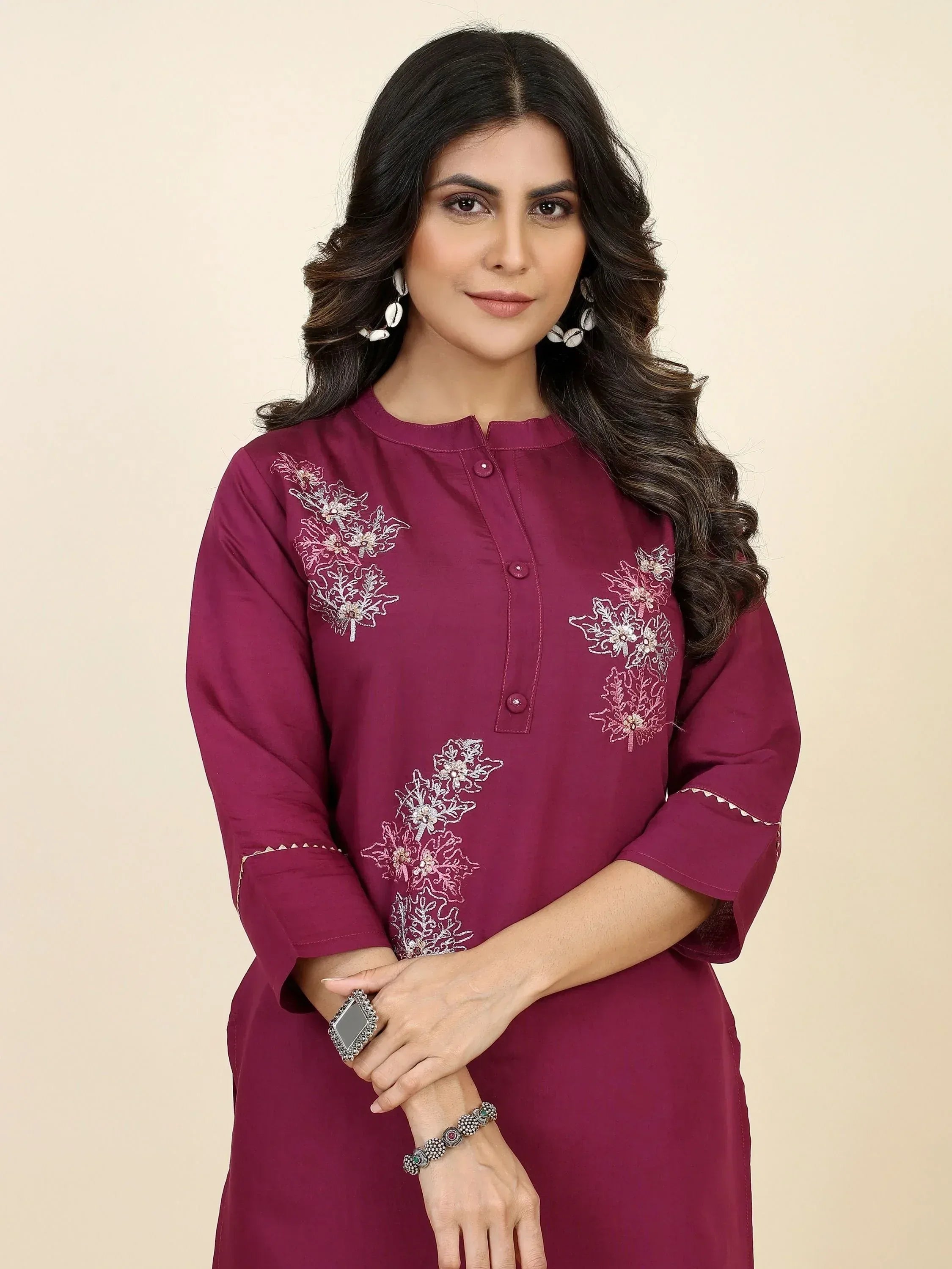 Maroon ethnic kurti with floral embroidery, perfect for Indian wear and festive occasions.