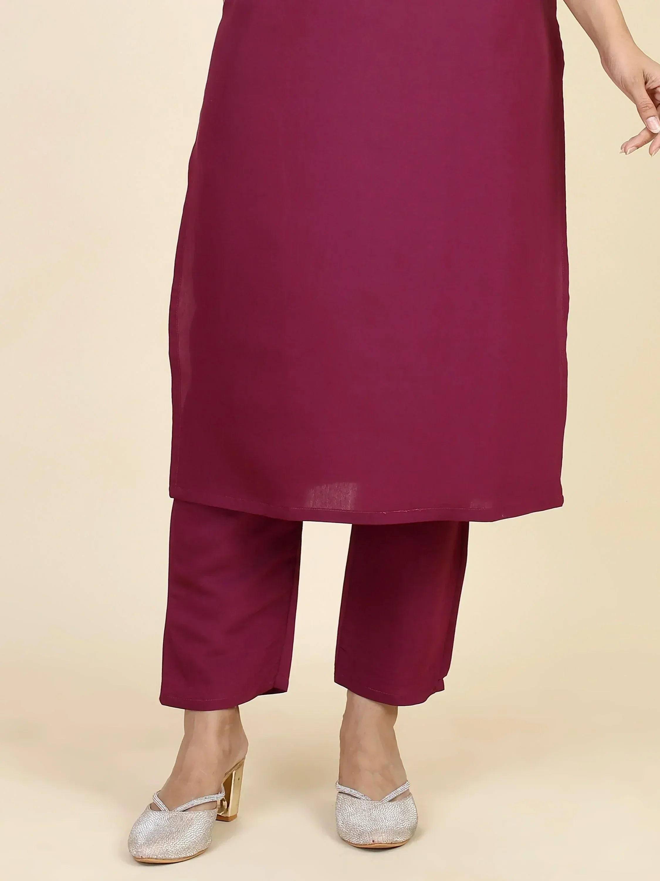 Solid maroon kurta with matching pants, styled with silver heels for ethnic wear