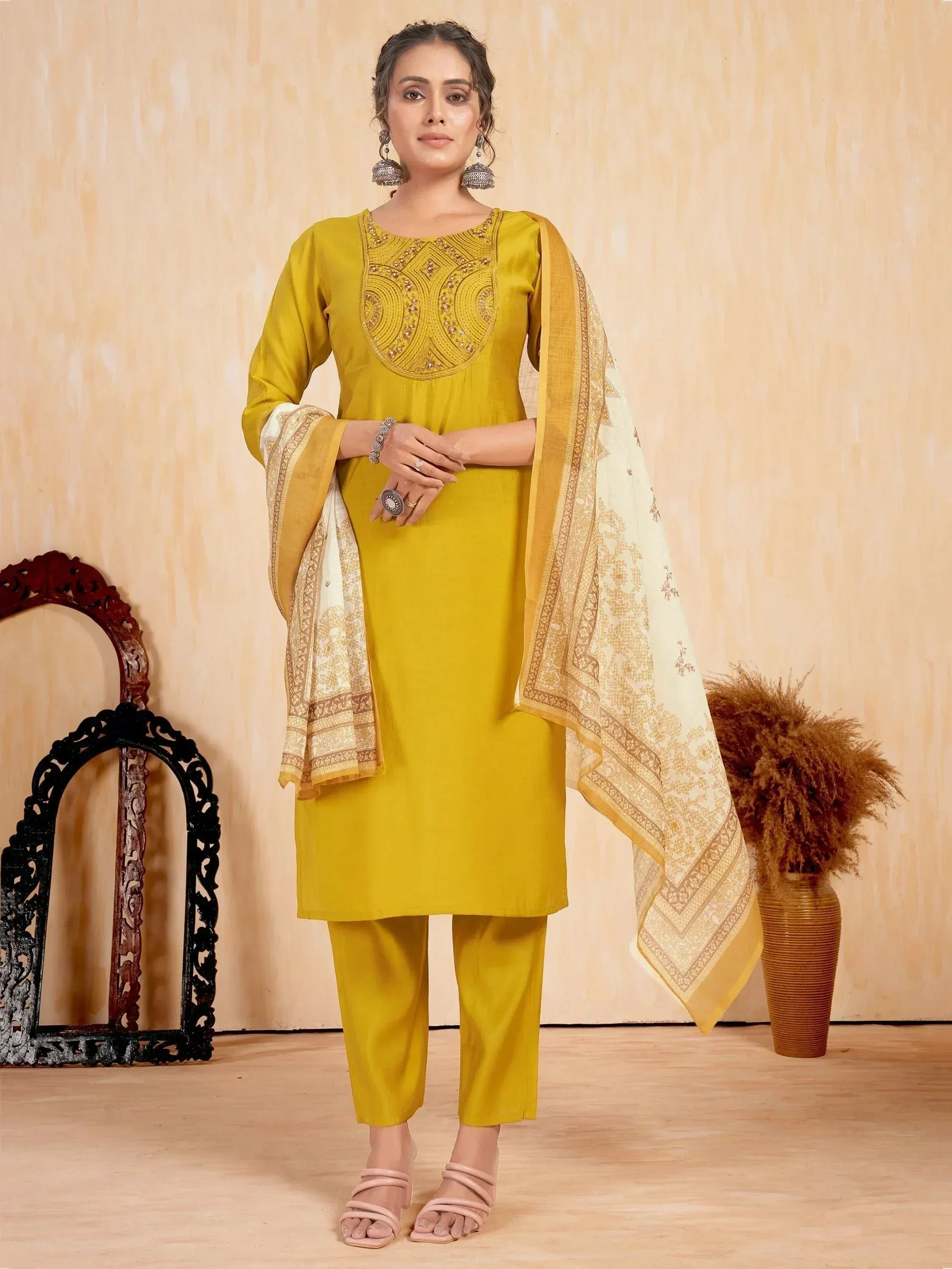 Yellow embroidered salwar kameez with matching dupatta, perfect for ethnic occasions