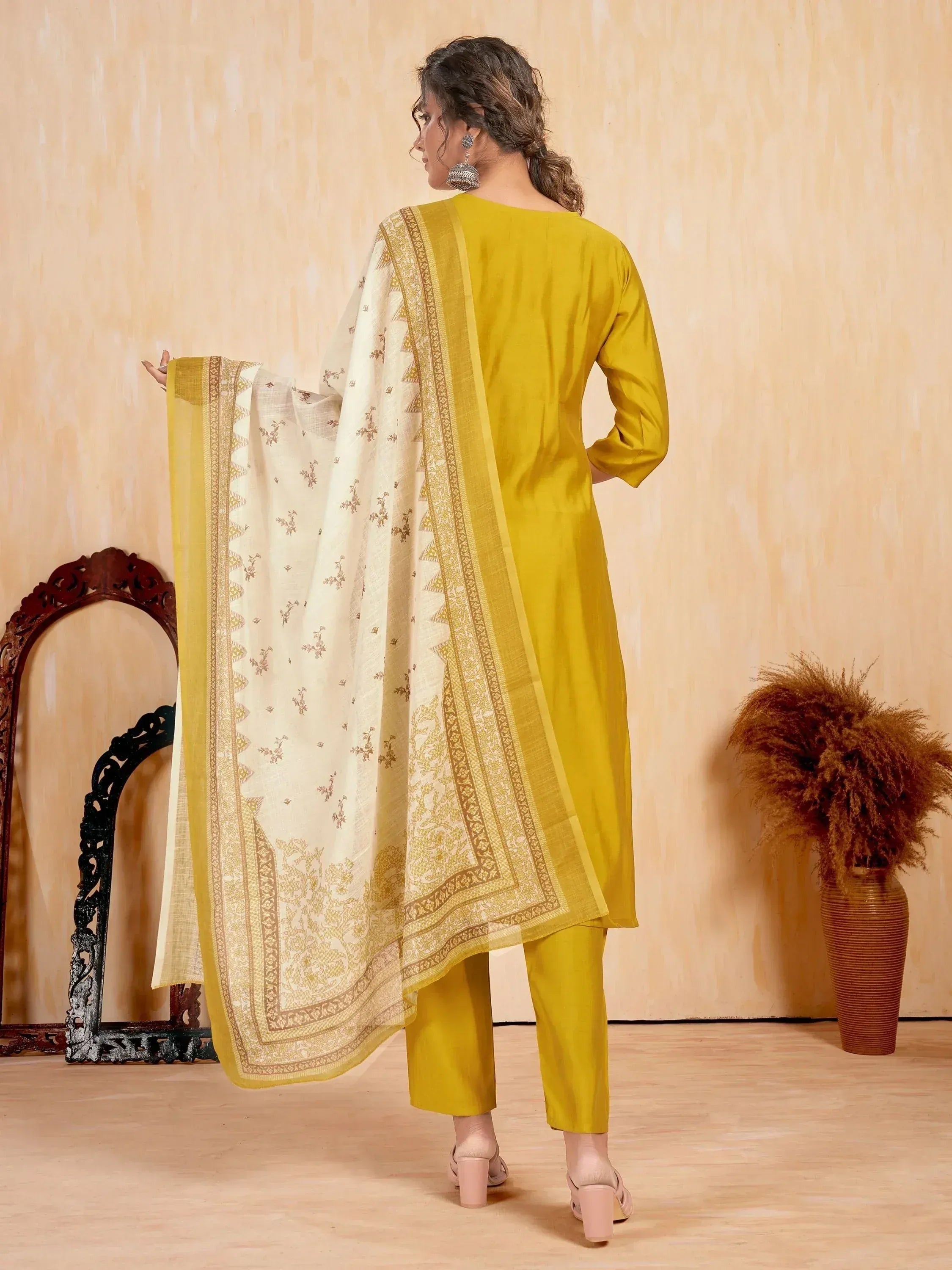 Yellow ethnic salwar kameez with floral dupatta, perfect for Indian occasions and festive wear.