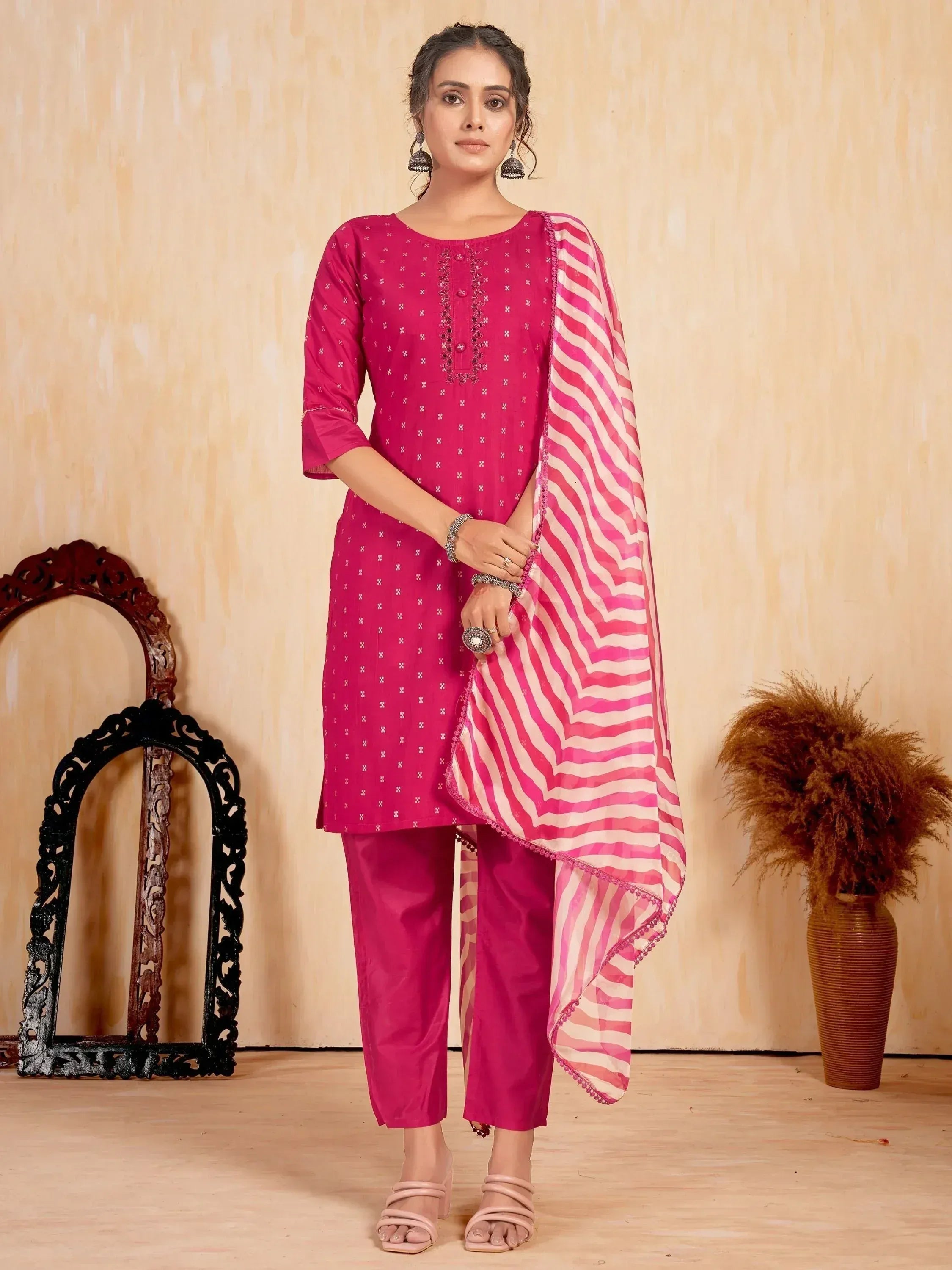 Woman in pink printed salwar kameez with striped dupatta, ethnic Indian wear