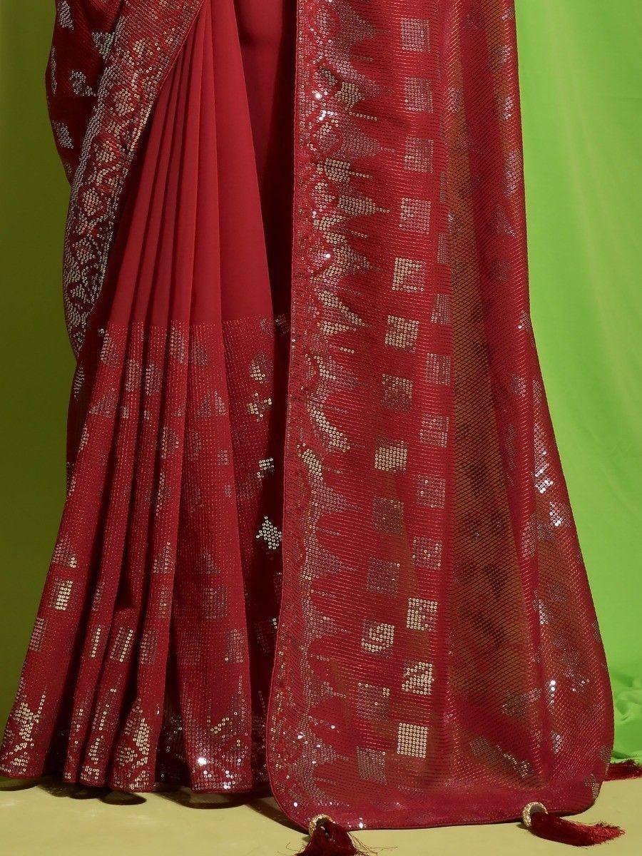 Red sequin embroidered saree with geometric patterns and tassels, ideal for festive occasions
