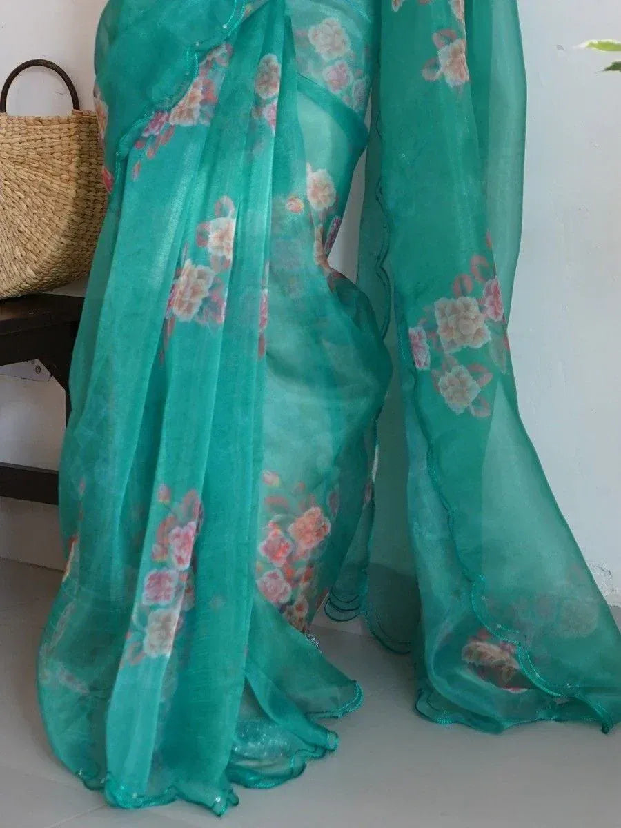 Teal floral printed saree with sheer fabric, perfect for ethnic occasions and Indian wear