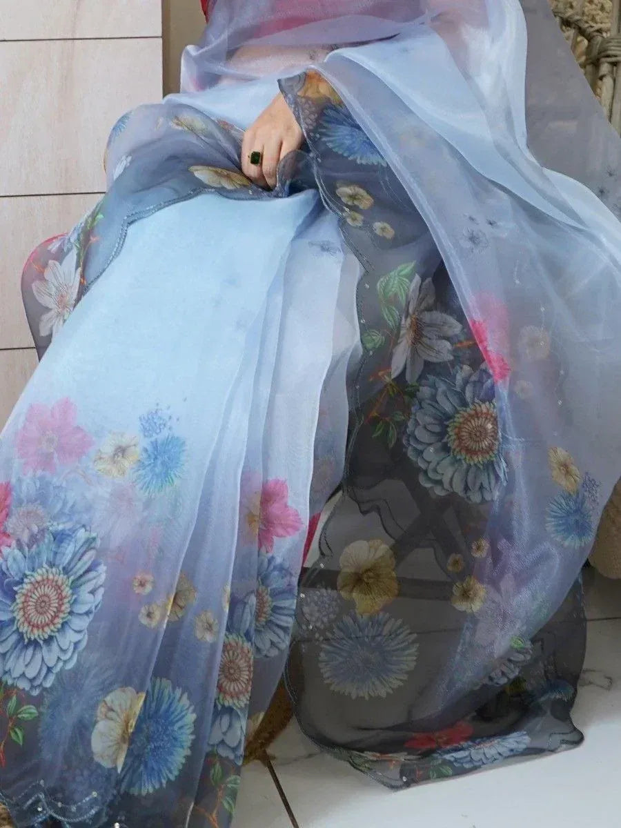 Floral print sheer ethnic gown with blue and pink blooms, perfect for Indian festive wear