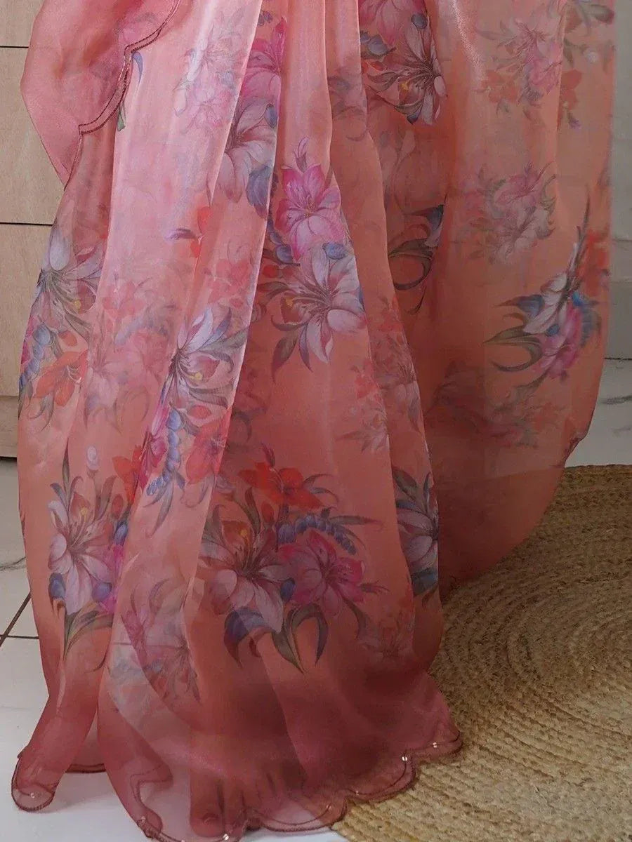 Pink floral printed ethnic gown with sheer fabric and scalloped hem, perfect for Indian occasions